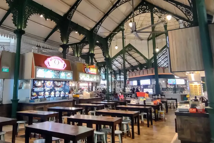 Street food hawker centre in singapore. Tables, chairs and street food stands.
