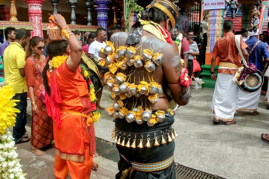 Cultural festival in Southeast Asia, man with hooks in his back.